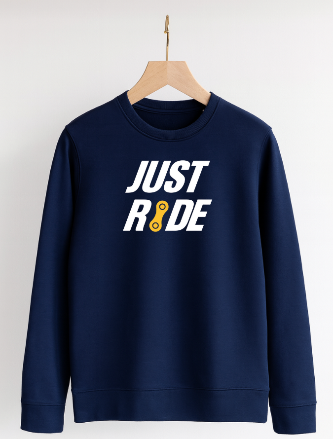 Navy blue sweatshirt with 'JUST RIDE' text on a wooden hanger against a white background
