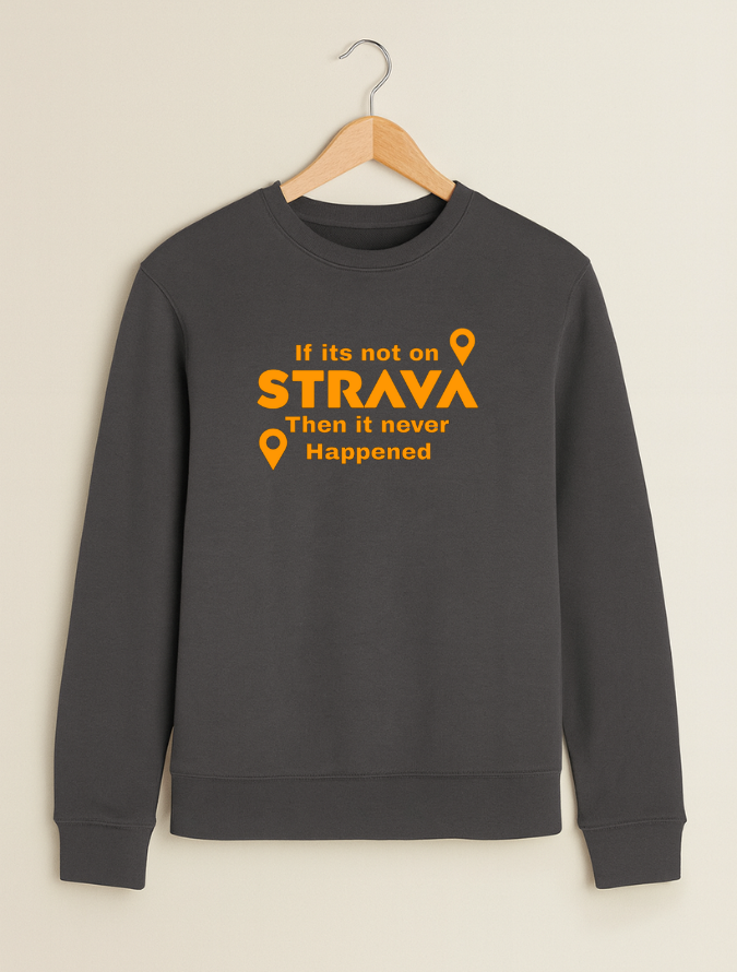 Grey sweatshirt with orange text and Strava logo on a beige background