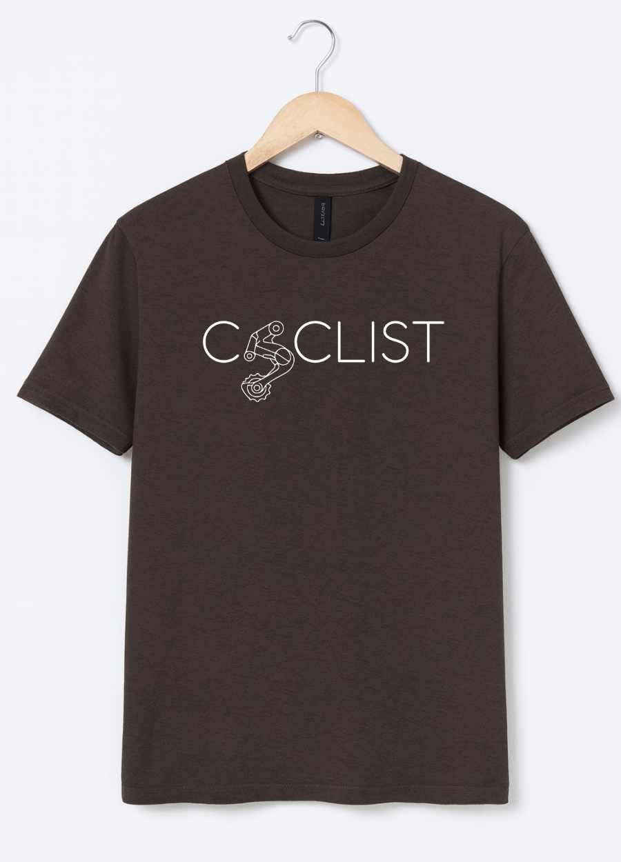 Brown t-shirt with 'Cyclist' text on a hanger against a white background