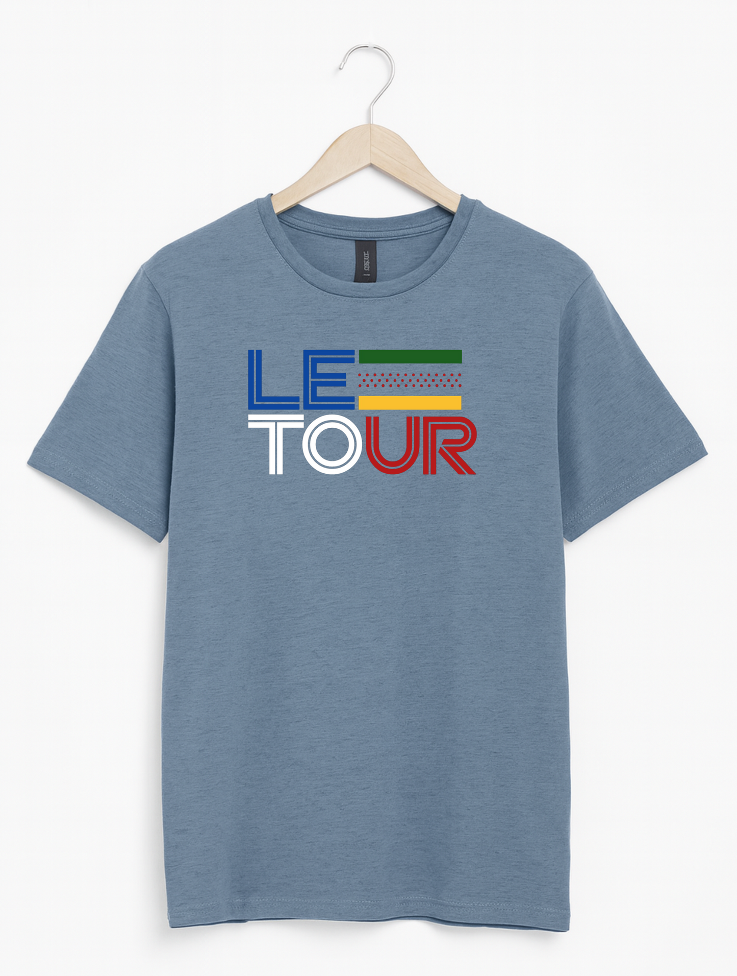 Blue t-shirt with 'Le Tour' text on a hanger against a white background